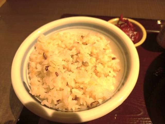 Yuzu-scented, aburi kitsune and mushroom ankake kyo udon noodles with accompanying rice.
